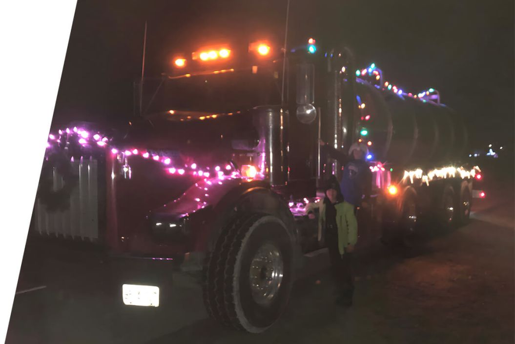 PP Pumping Ltd. truck with Christmas lights on it in the dark